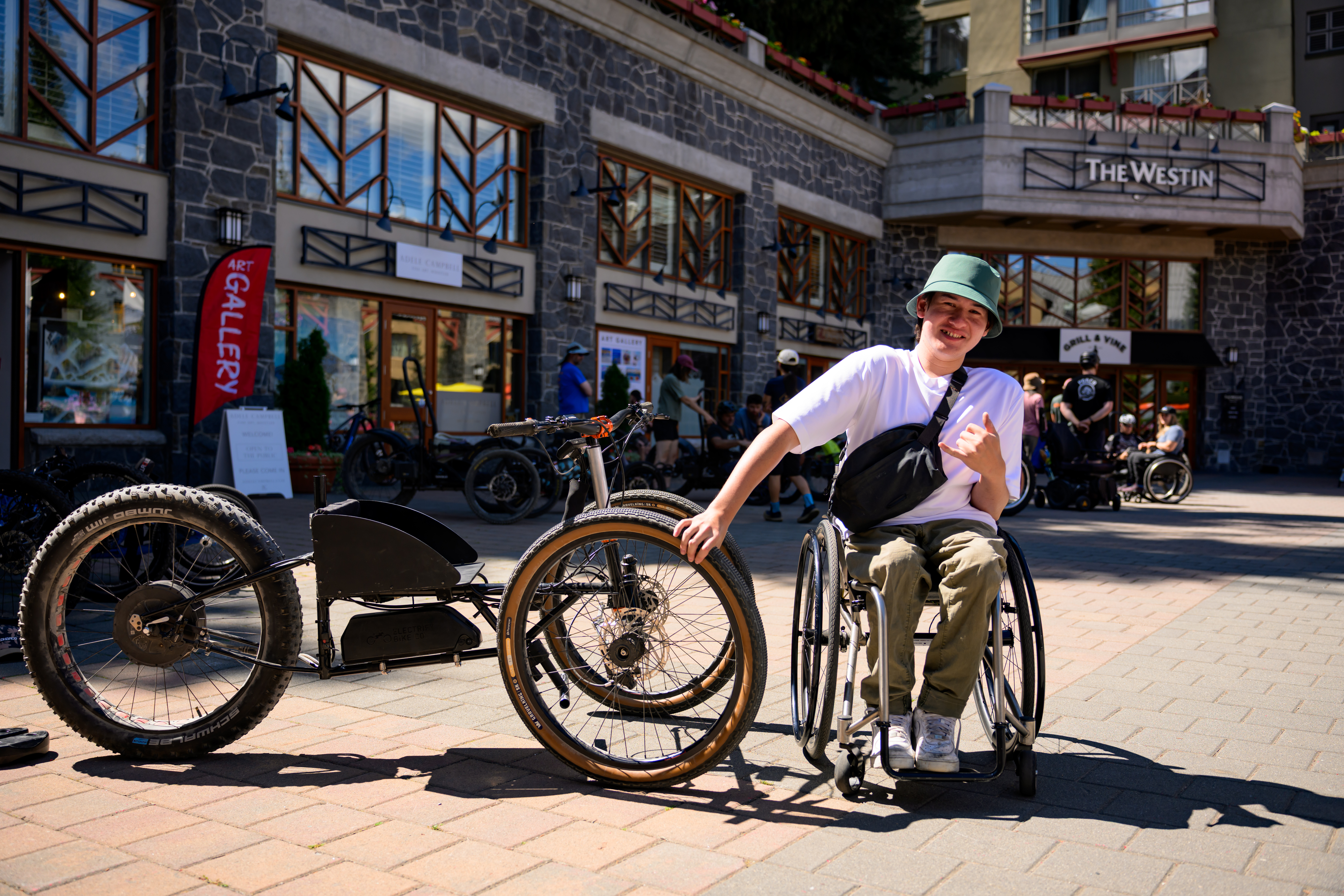 Rider beside the physical KOINE prototype at a public meetup